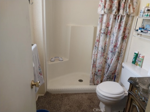 bathroom with walk in shower, vanity, and toilet