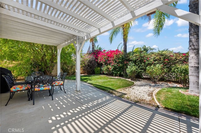 view of patio featuring outdoor dining area and a pergola