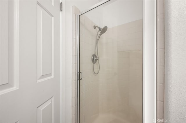 full bathroom featuring a stall shower