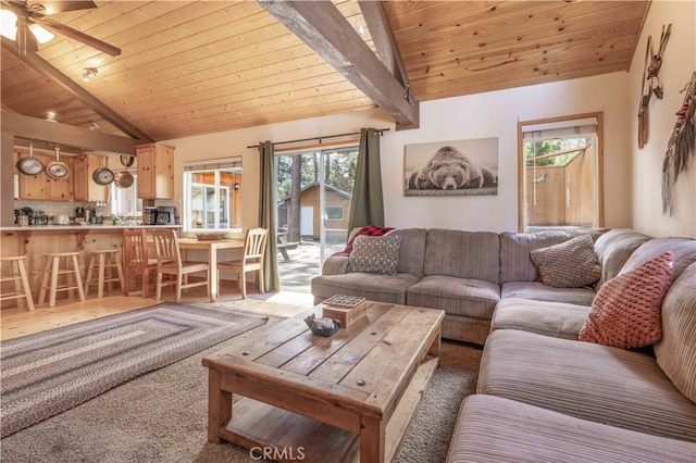 living room with ceiling fan, wooden ceiling, and a healthy amount of sunlight