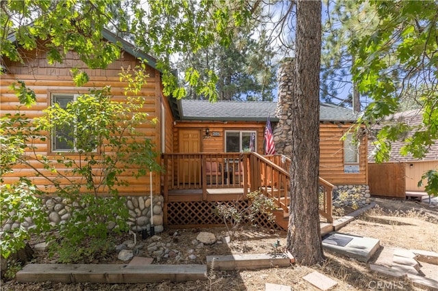 rear view of property with a deck