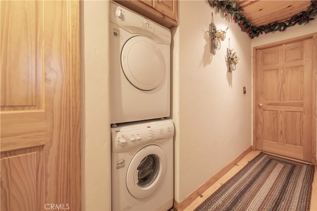 laundry room featuring stacked washer and dryer