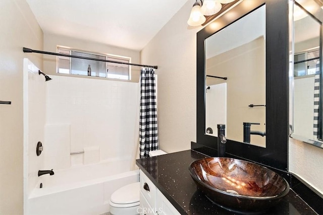 full bath featuring toilet, shower / bathtub combination with curtain, and vanity