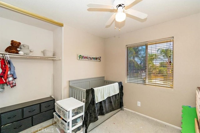 bedroom featuring carpet floors, baseboards, and a ceiling fan