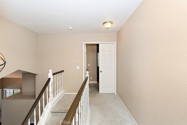 corridor with light colored carpet