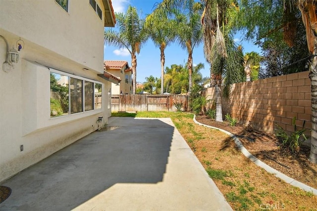 view of yard with a patio and a fenced backyard