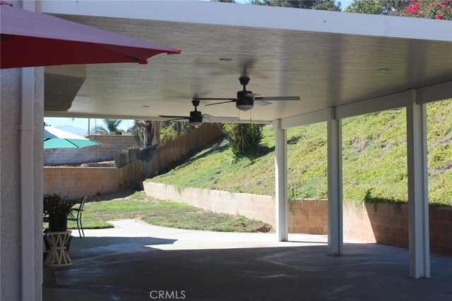 view of patio featuring ceiling fan