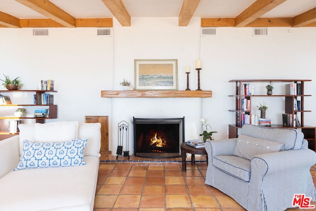 living room featuring beamed ceiling