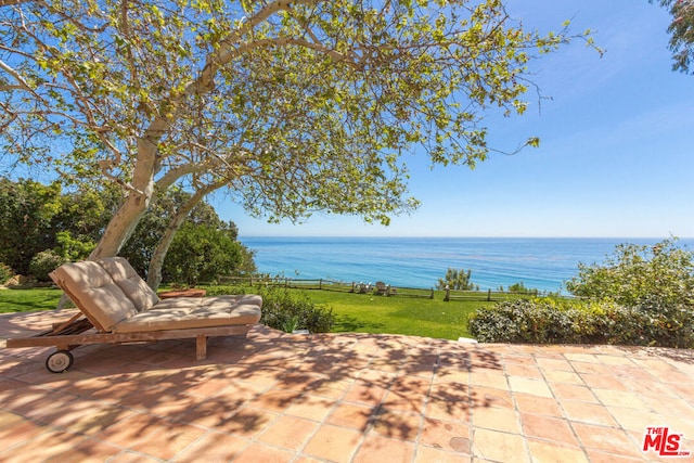 view of patio with a water view