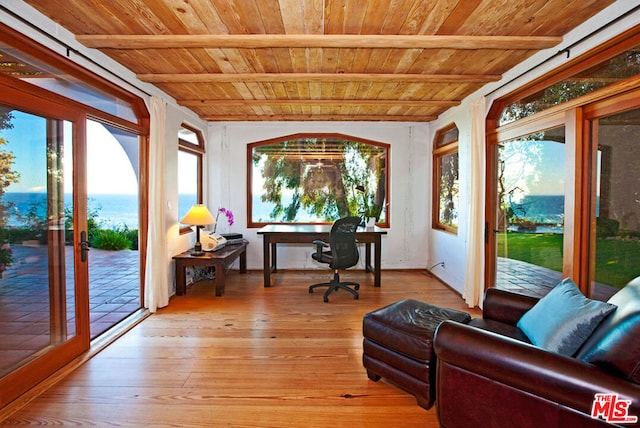 sunroom / solarium with beamed ceiling and wooden ceiling