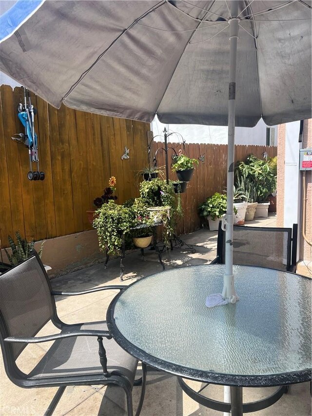 view of patio / terrace featuring fence