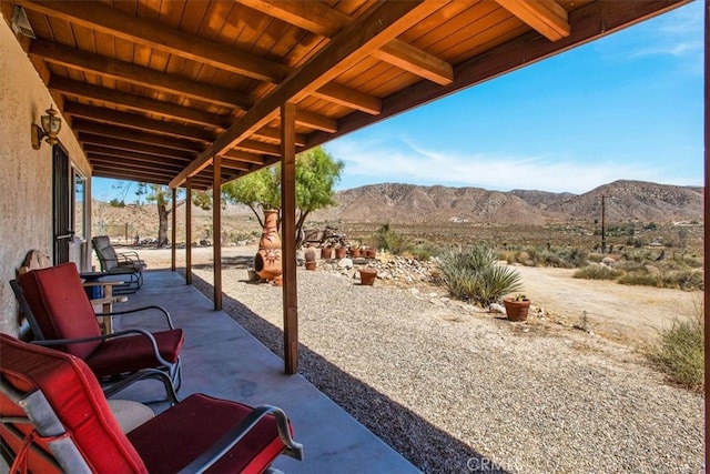 view of patio / terrace with a mountain view