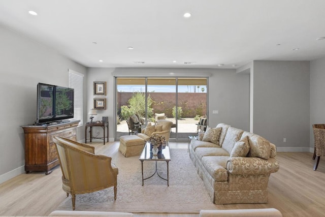 living room with light hardwood / wood-style floors