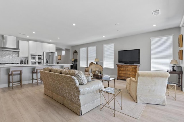 living room with light hardwood / wood-style flooring