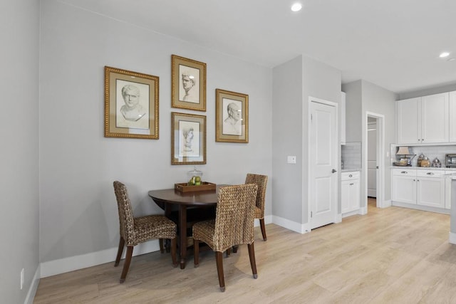 dining room with light wood-type flooring