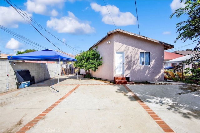 rear view of house with a patio