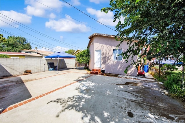 rear view of house featuring a patio area