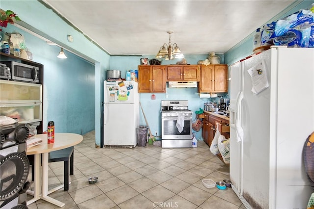 kitchen featuring decorative light fixtures, stainless steel appliances, light tile patterned floors, and a notable chandelier