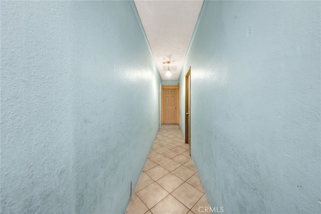 corridor featuring light tile patterned flooring