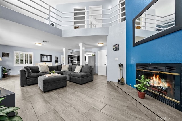 living room with a towering ceiling