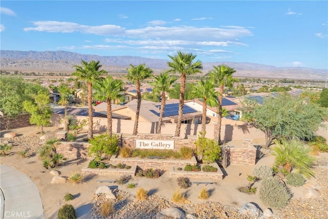 birds eye view of property with a mountain view