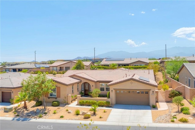 view of front of property featuring a mountain view and a garage