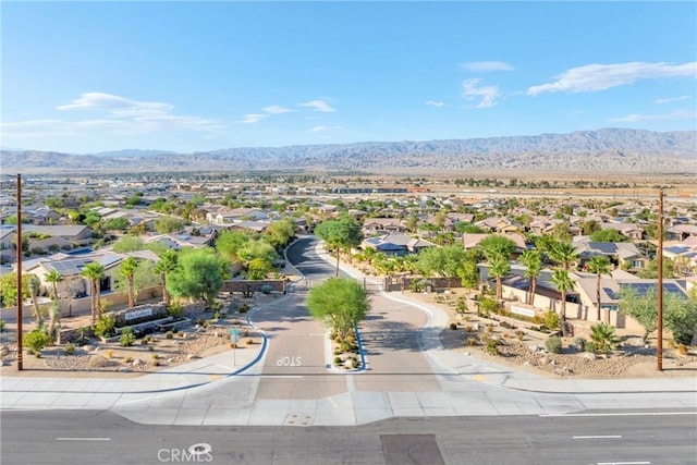 birds eye view of property featuring a mountain view