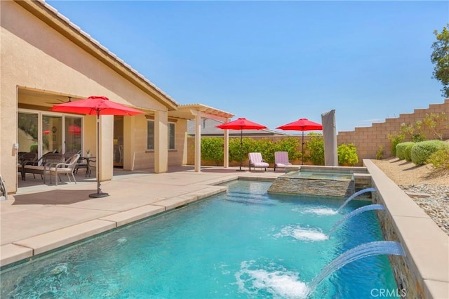 view of pool with an in ground hot tub, a patio area, and pool water feature