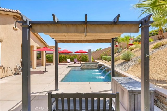 view of swimming pool with an in ground hot tub, pool water feature, and a patio