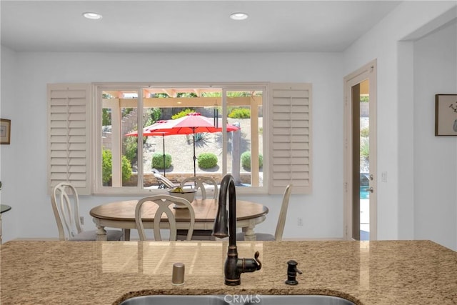 dining room with sink and a healthy amount of sunlight