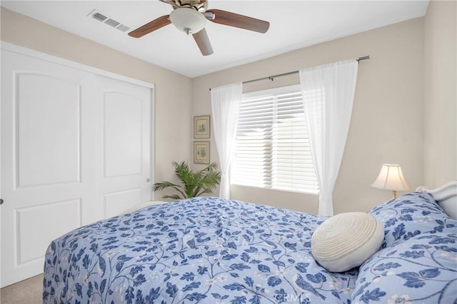 bedroom featuring carpet, a closet, and ceiling fan