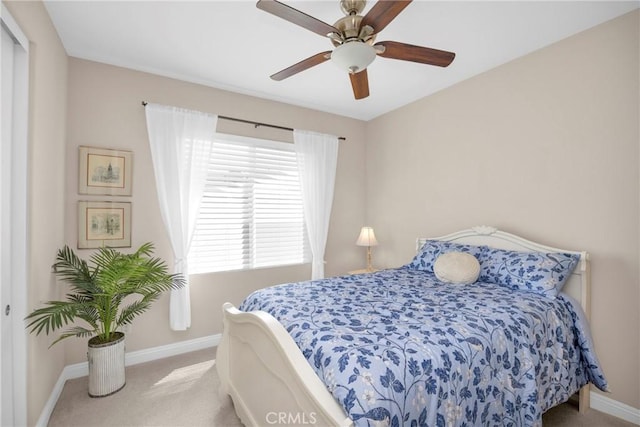 carpeted bedroom featuring ceiling fan