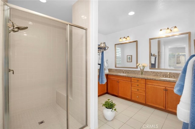 bathroom featuring vanity, tile patterned floors, and an enclosed shower