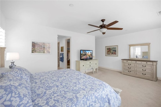 bedroom with light carpet and ceiling fan