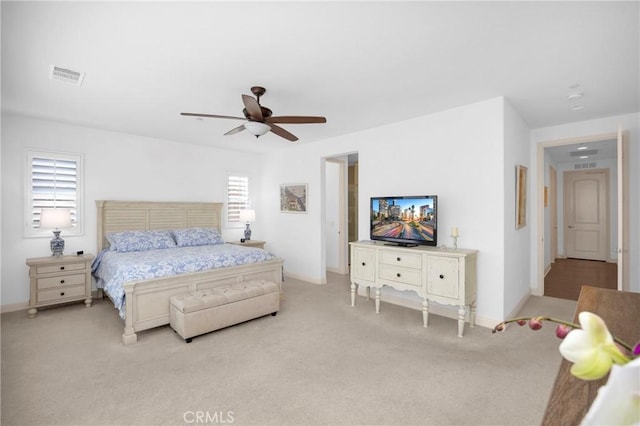 bedroom featuring ceiling fan and light colored carpet