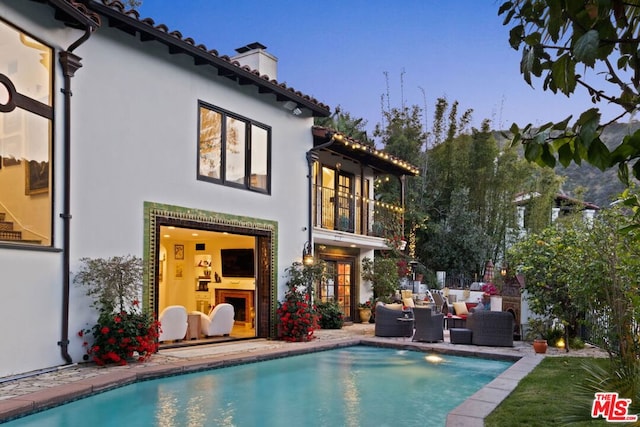 view of pool with a patio and an outdoor hangout area