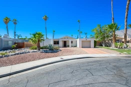 ranch-style house featuring a garage