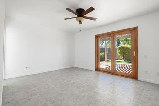 unfurnished room with ceiling fan