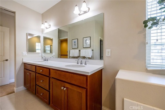 bathroom with tile patterned floors and vanity