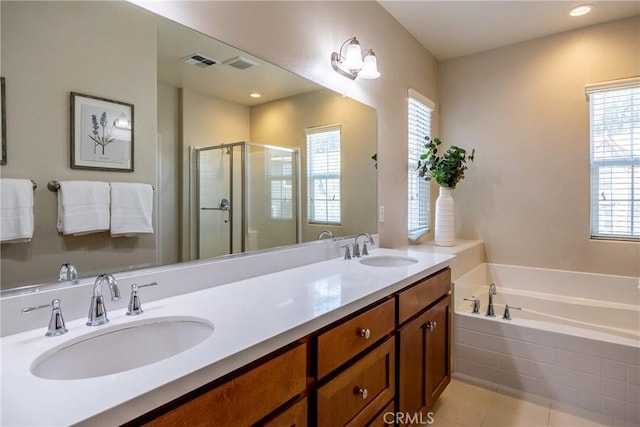 bathroom featuring vanity, tile patterned floors, shower with separate bathtub, and a healthy amount of sunlight