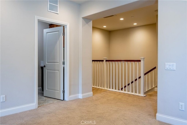 corridor with light carpet