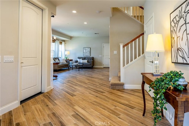 foyer entrance with light wood-type flooring