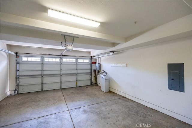 garage featuring a garage door opener and electric panel