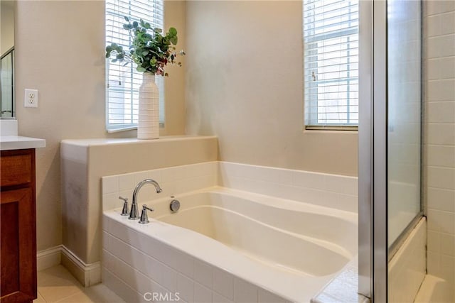 bathroom with vanity, tile patterned floors, and independent shower and bath