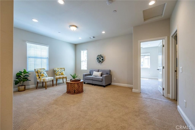 living area with light colored carpet