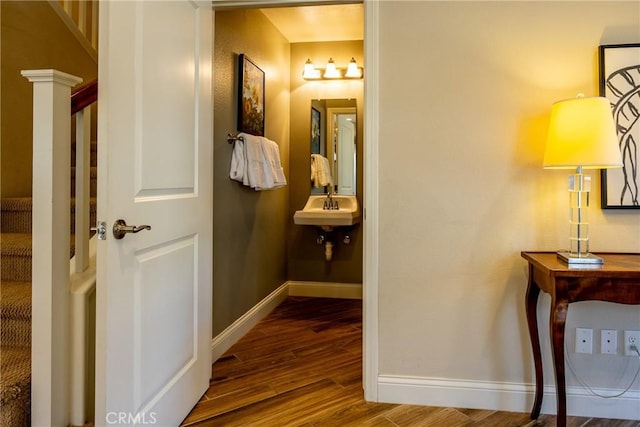 bathroom featuring sink and hardwood / wood-style floors