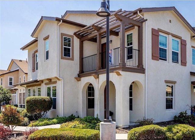 view of front of property with a pergola