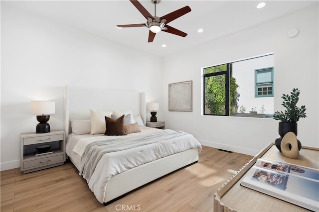 bedroom featuring ceiling fan and light wood-type flooring