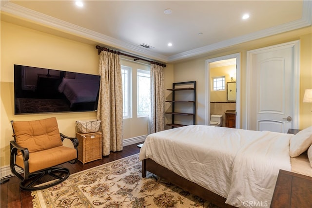 bedroom with ensuite bathroom, dark hardwood / wood-style flooring, and ornamental molding