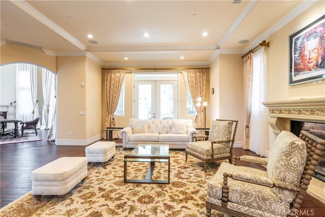 living room with hardwood / wood-style flooring, crown molding, and french doors